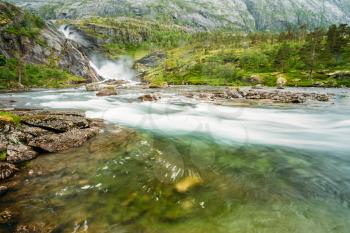 Waterfall in the Valley of waterfalls in Norway. Husedalen Waterfalls were a series of four giant waterfalls in South Fjord.