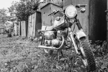 Old Motor Cycle Parked On Grass Yard. Vintage Generic Motorcycle Motorbike In Countryside