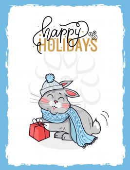 Merry Christmas postcard happy holidays with gray bunny dressed in knitted winter hat and scarf. Sitting with red present and calligraphic lettering, vector