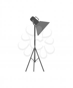 Light projector or spotlight on tripod for photo studio. Lamp with metal stand, equipment of professional photographers vector illustration isolated.