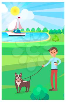 Boy walking dog and holding hot drink in public park with lake and floating yacht on background. Healthy relaxation outdoors in summer
