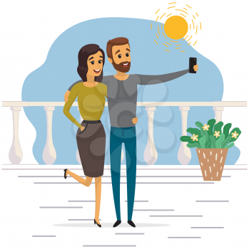 Young man and woman standing and making self portrait with mobile phone camera. Relationship and technology concept. Couple with phone is posing for joint photo. People take selfies together
