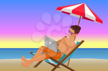 Joyful man with laptop on beautiful evening beach, summer sunset, striped umbrella, cozy lounger, beautiful view on summer sunset, calm sea water