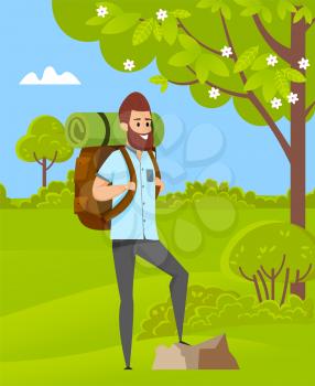 Hiker wearing casual clothes and backpack standing outdoor, green grass, tree and bush. Portrait view of male standing near rock in forest, hiking hobby vector