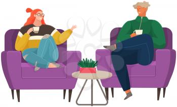 Relaxed people are talking together, sitting in comfortable armchairs with hot drinks.. Man and woman communicating, resting on chairs. Positive communication of friends during coffee break