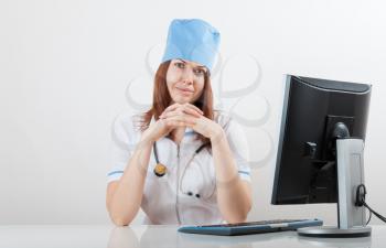 doctor on a workplace at the computer