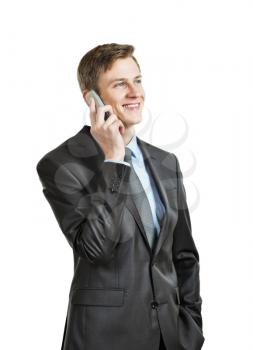 successful businessman in a suit and tie, smiling and talking on the phone. isolated on white