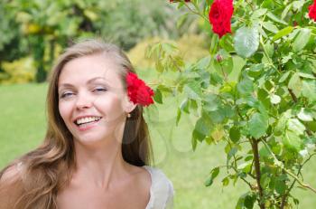 beautiful happy woman among the flowers