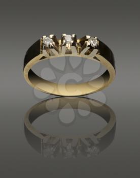 womanish ring of pure gold with diamonds on black background
