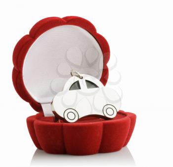  keychain car in red gift box. isolated on white
