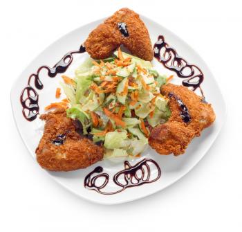 fried chicken wings with vegetable salad isolated on white with clipping paths