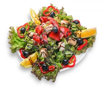 Fresh Greek salad on a plate isolated on white background.