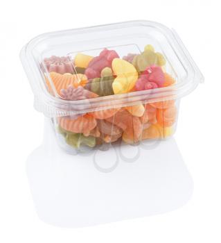 fruit jellies marmalade in a plastic food box, isolated on a white background with clipping path