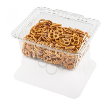 crackers in a transparent plastic container on a white background isolated with clipping path