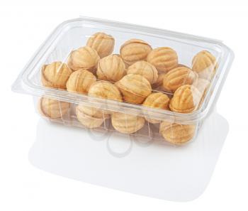 round cookie nuts in a transparent food container, isolated on a white background with clipping path