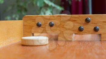 Typical dutch wooden boardgame - Sjoelen - Selective focus