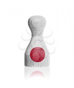 Wooden pawn with a painting of a flag, Japan