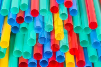 Different colors of straws (green, blue, yellow, red)