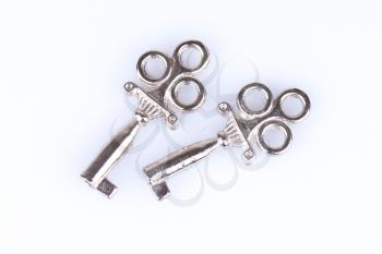 Two old keys on a white background