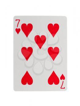 Old playing card (seven) isolated on a white background