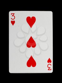 Playing card (three) isolated on a black background