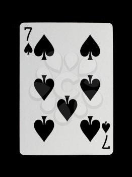 Playing card (seven) isolated on a black background