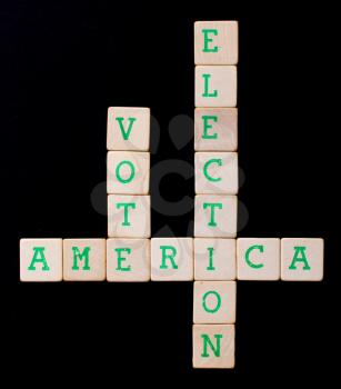 Letters on wooden blocks (America, vote, election)