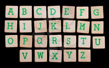 Alphabet in letters on old wooden blocks