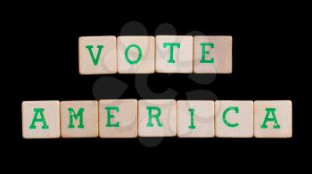 Letters on wooden blocks (America, vote)