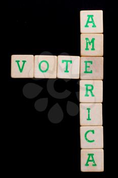 Letters on wooden blocks (America, vote)
