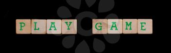 Green letters on old wooden blocks (play game)