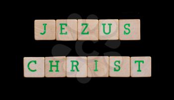 Green letters on old wooden blocks (Jezus Christ)