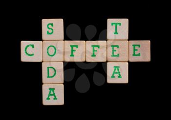 Green letters on old wooden blocks (coffee, tea, soda)