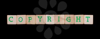 Green letters on old wooden blocks (copyright)