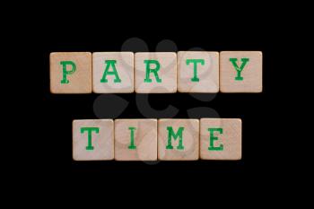 Party time spelled out in old wooden blocks
