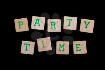 Party time spelled out in old wooden blocks