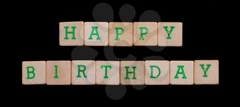 Green letters on old wooden blocks (happy birthday)