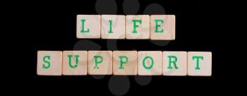 Green letters on old wooden blocks (life support)