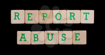 Green letters on old wooden blocks (report abuse)