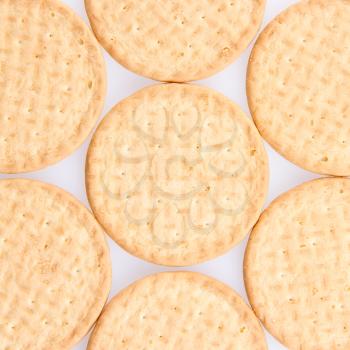 A few round biscuits on a grey background