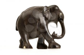 Very old ivory statue of an elephant isolated on a white beckground