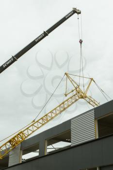 LEEUWARDEN,FRIESLAND,HOLLAND-JUNE 1: Mobile tower crane has collapsed on top of a building. June 1, 2012, Friesland, Holland.