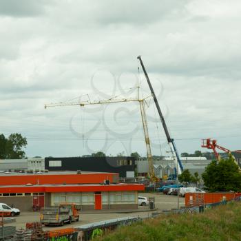 LEEUWARDEN,FRIESLAND,HOLLAND-JUNE 1: Mobile tower crane has collapsed on top of a building. June 1, 2012, Friesland, Holland.
