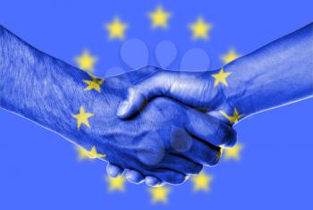 Man and woman shaking hands, wrapped in flag pattern, European Union