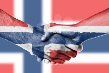 Man and woman shaking hands, wrapped in flag pattern, Norway