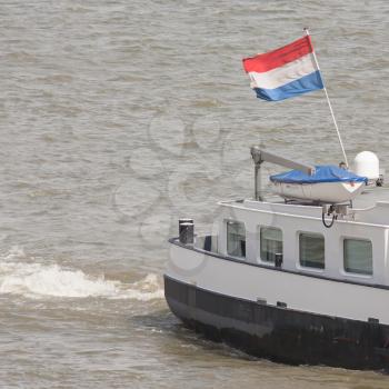 The Dutch national flag on a ship in the harbor of Rotterdam