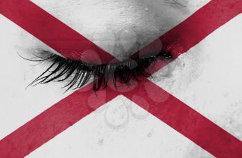 Crying woman, pain and grief concept, flag of Alabama