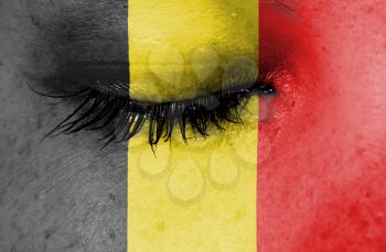 Crying woman, pain and grief concept, flag of Belgium