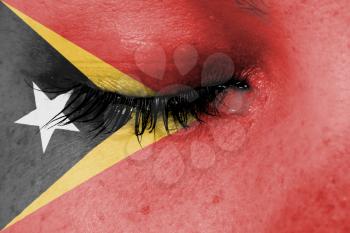 Crying woman, pain and grief concept, flag of East Timor