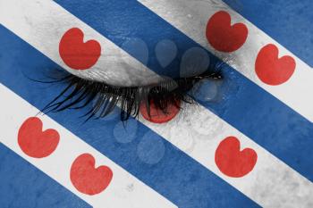 Crying woman, pain and grief concept, flag of Friesland